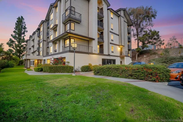a view of a building with a yard