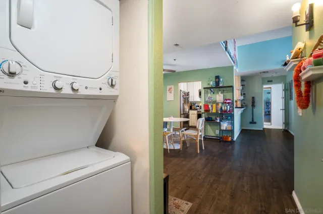 a view of living room with furniture and wooden floor