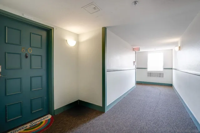 a view of hallway with cabinets