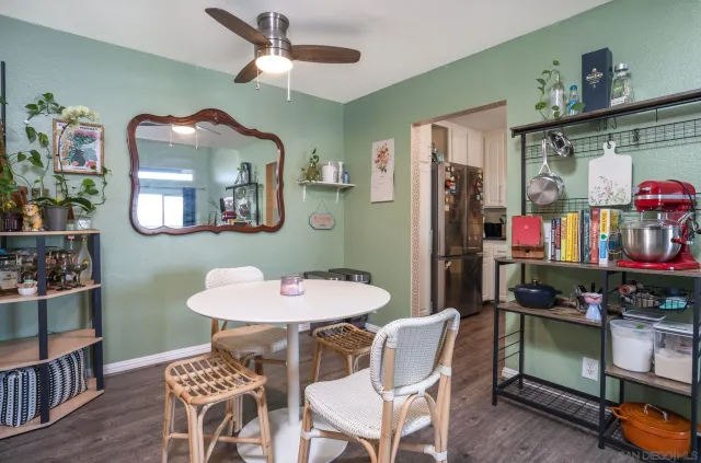 a dining room with furniture and window