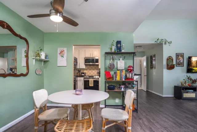 a view of a dining room with furniture and wooden floor
