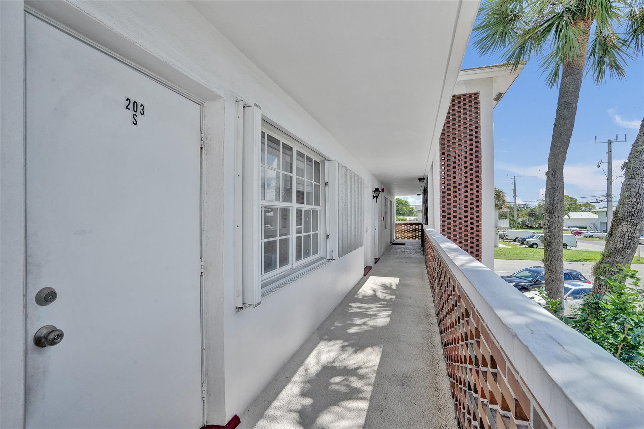 2050 Northeast 39th Street, Unit 203S Lighthouse Point, FL 33064 - Photo 11 of 16 a view of a balcony with furniture