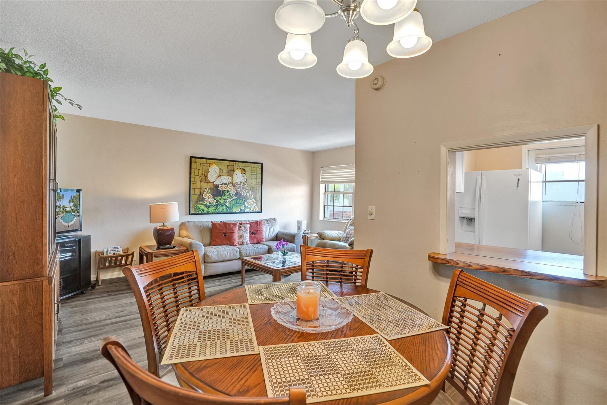2050 Northeast 39th Street, Unit 203S Lighthouse Point, FL 33064 - Photo 4 of 16 a living room with furniture dining table and wooden floor