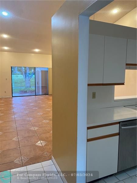 3551 Inverrary Boulevard Lauderhill, FL 33319 - Photo 13 of 22 a view of an empty room with wooden floor and cabinets