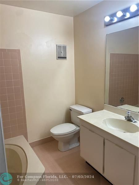 3551 Inverrary Boulevard Lauderhill, FL 33319 - Photo 20 of 22 a bathroom with a toilet a sink and mirror