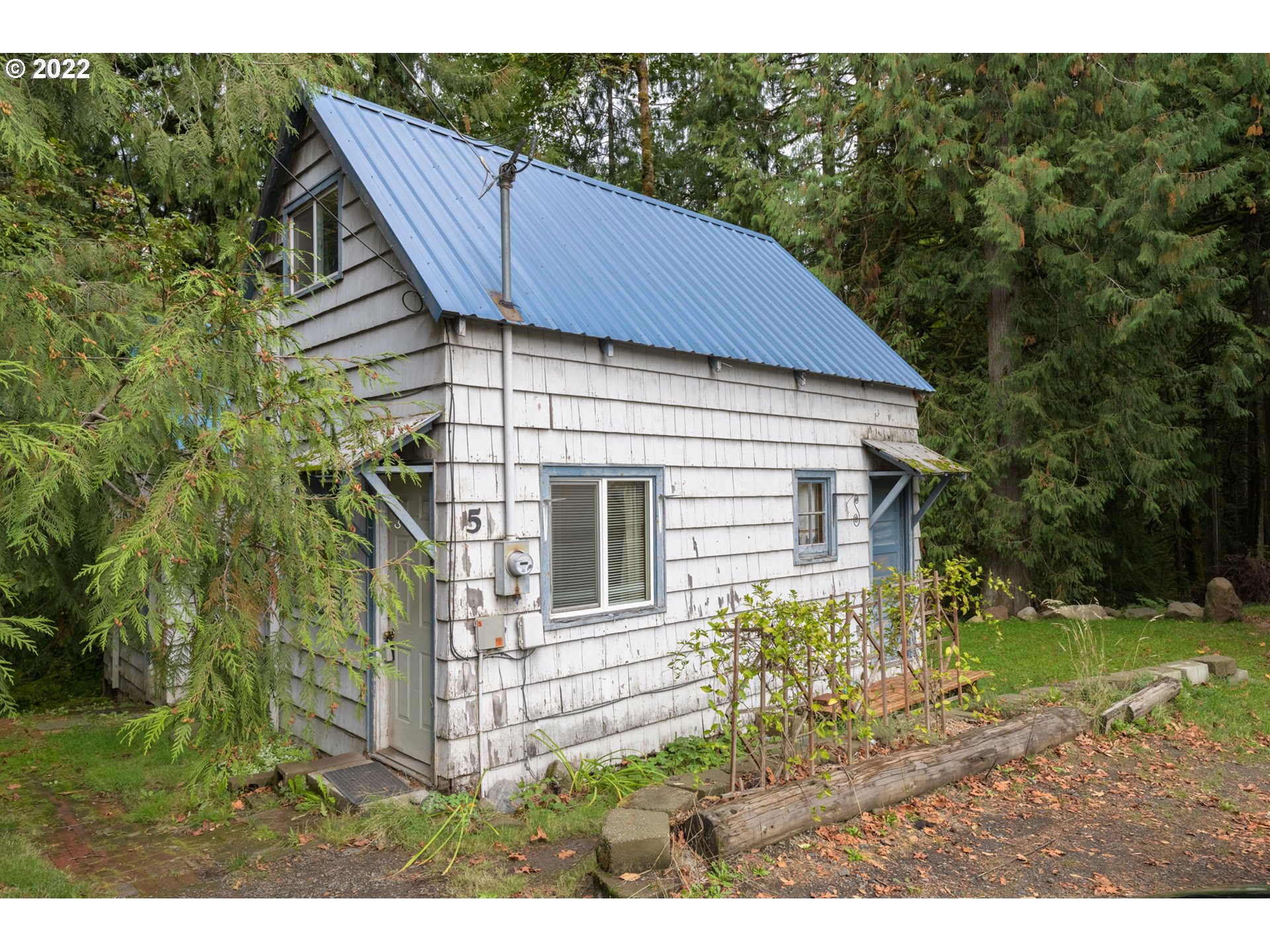 69947 East E Highway, Unit 5 Rhododendron, OR 97049 - Photo 1 of 31 a view of a house with backyard