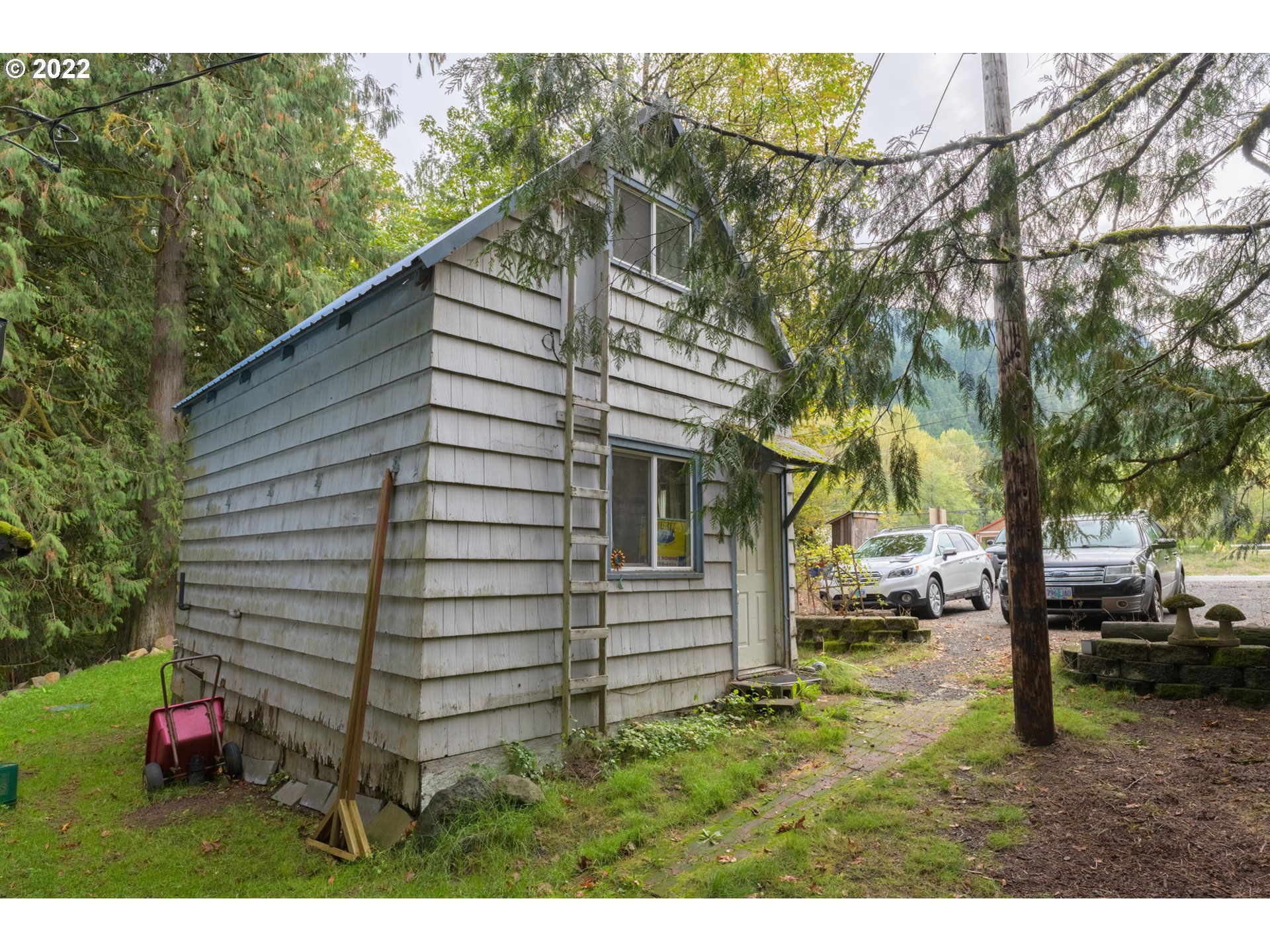 69947 East E Highway, Unit 5 Rhododendron, OR 97049 - Photo 2 of 31 a view of a house with a backyard