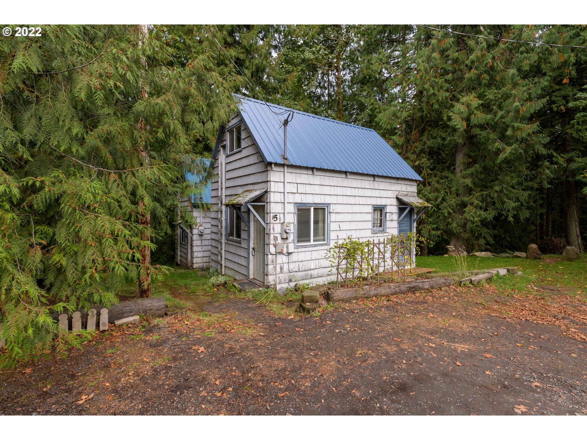 69947 East E Highway, Unit 5 Rhododendron, OR 97049 - Photo 7 of 31 a view of a house with a yard