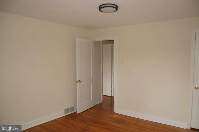 a view of a livingroom with wooden floor