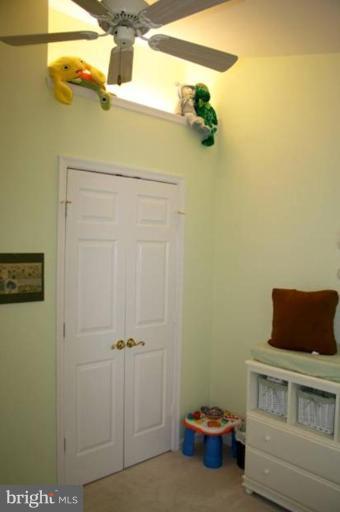311 Ridgepoint Place Gaithersburg, MD 20878 - Photo 17 of 30 Bedroom 3's lighted plant shelf & vaulted ceiling