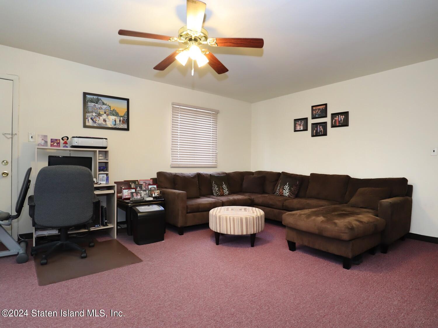 28 Gary Place Staten Island, NY 10314 - Photo 13 of 28 a living room with furniture and a ceiling fan