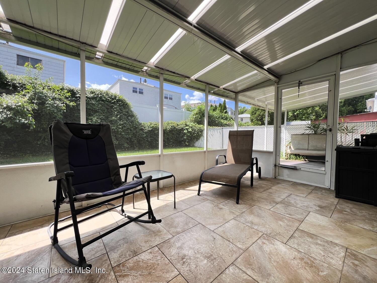 28 Gary Place Staten Island, NY 10314 - Photo 20 of 28 a building outdoor space with patio furniture and a potted plant