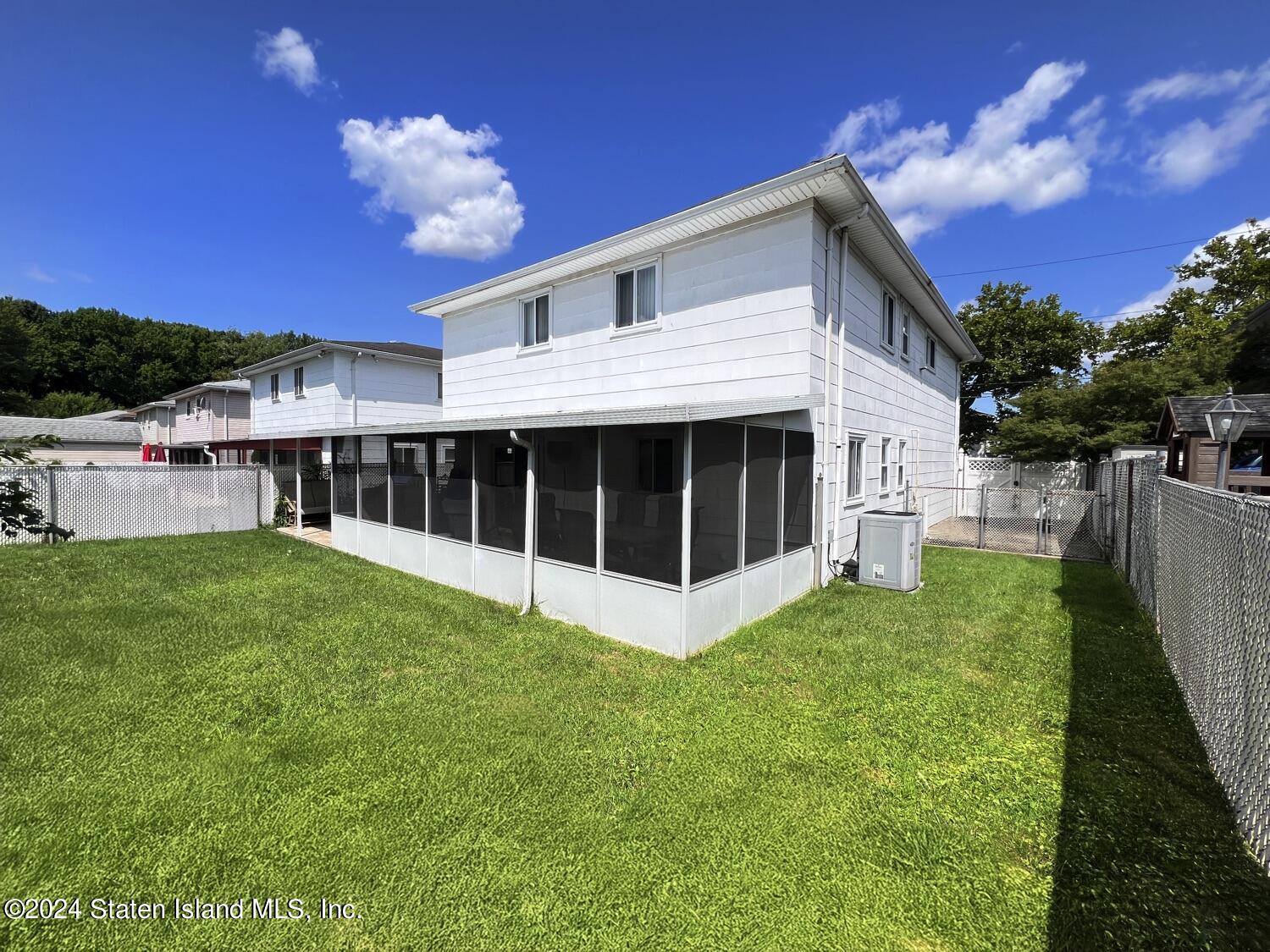 28 Gary Place Staten Island, NY 10314 - Photo 22 of 28 a view of house with backyard porch and entertaining space