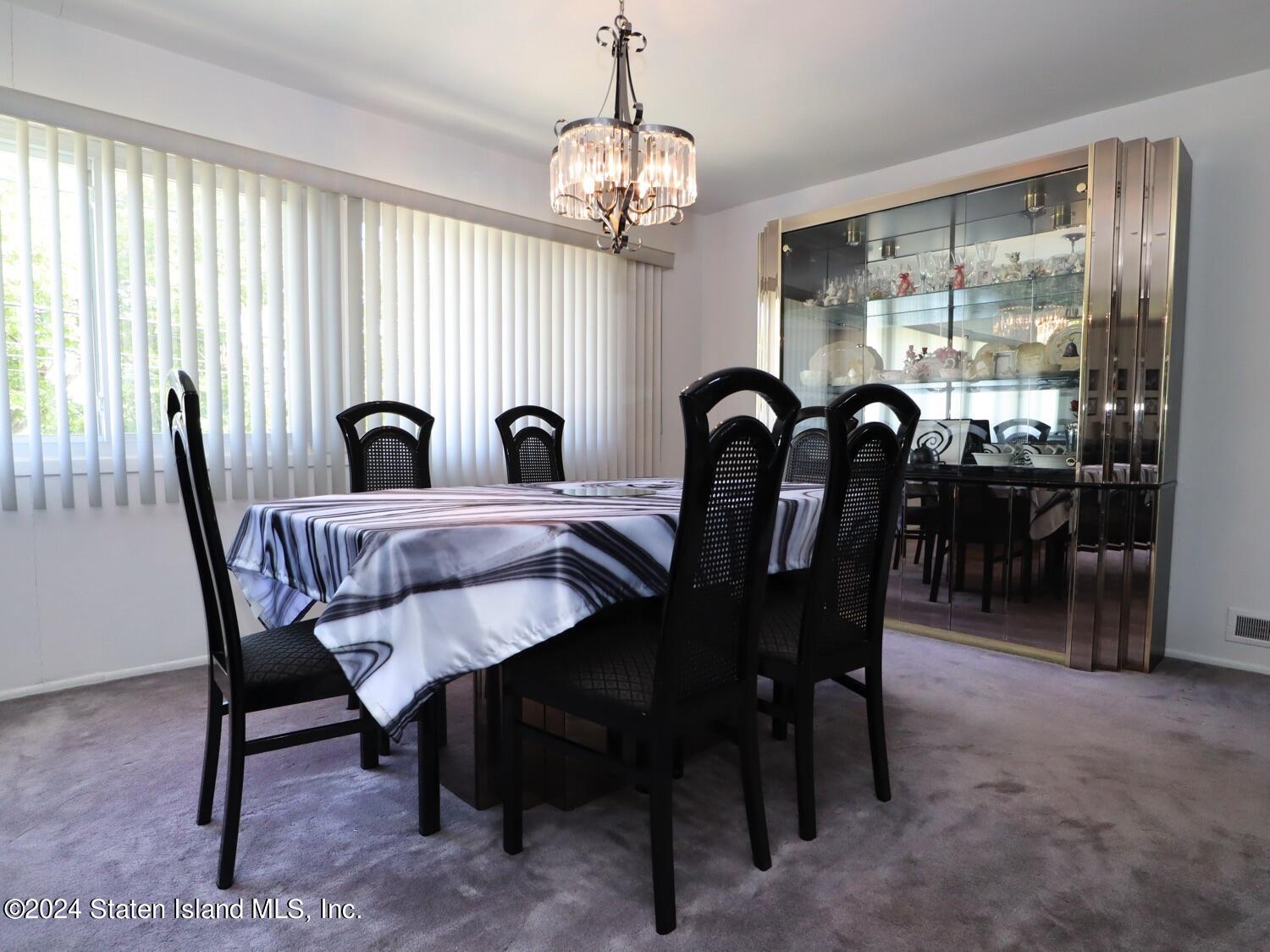 28 Gary Place Staten Island, NY 10314 - Photo 6 of 28 a view of a dining room with furniture window and outside view