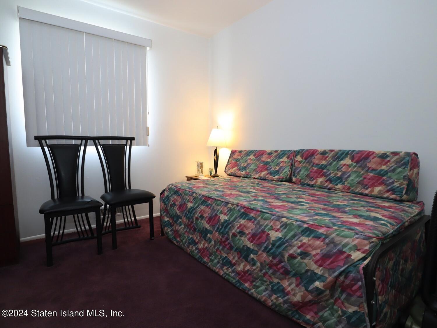 28 Gary Place Staten Island, NY 10314 - Photo 10 of 28 a bedroom with a bed and a desk