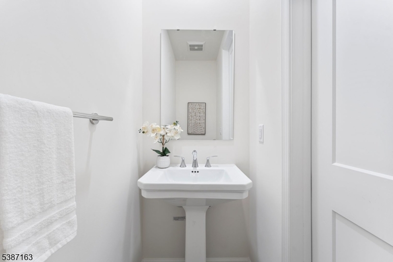 221 Myrtle Road Warren, NJ 07059 - Photo 16 of 37 a bathroom with a sink a mirror and a shower