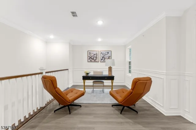 a workspace with furniture and a bathroom