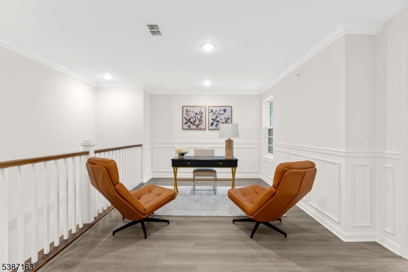 221 Myrtle Road Warren, NJ 07059 - Photo 19 of 37 a living room with furniture and a chair