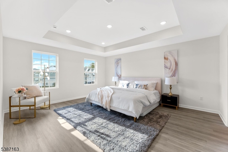 221 Myrtle Road Warren, NJ 07059 - Photo 21 of 37 a bedroom with a bed and wooden floor