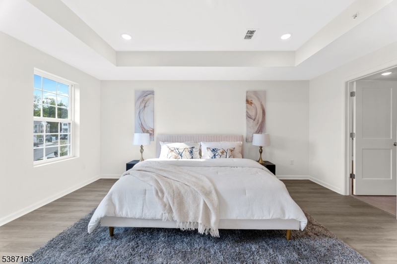 221 Myrtle Road Warren, NJ 07059 - Photo 22 of 37 a bedroom with a bed and a window