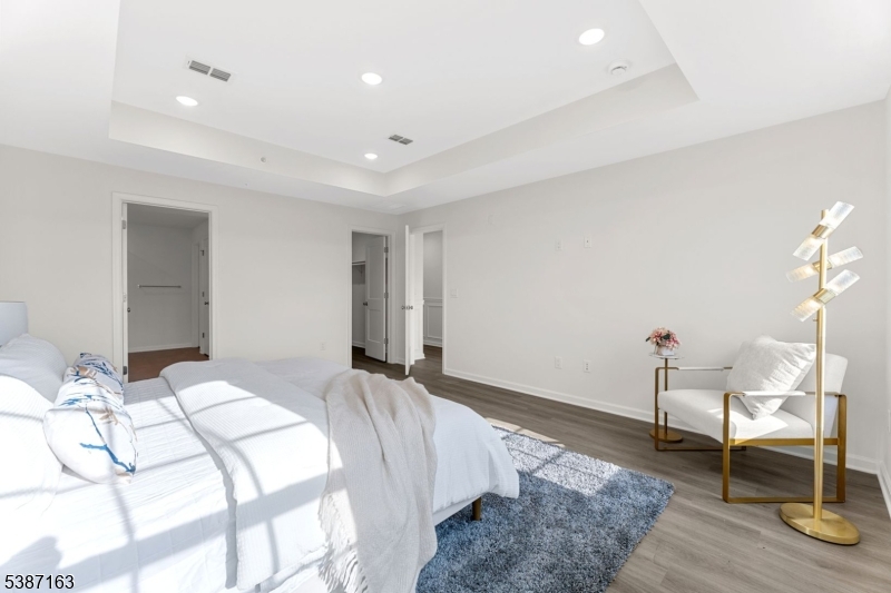 221 Myrtle Road Warren, NJ 07059 - Photo 23 of 37 a bedroom with a bed and a table