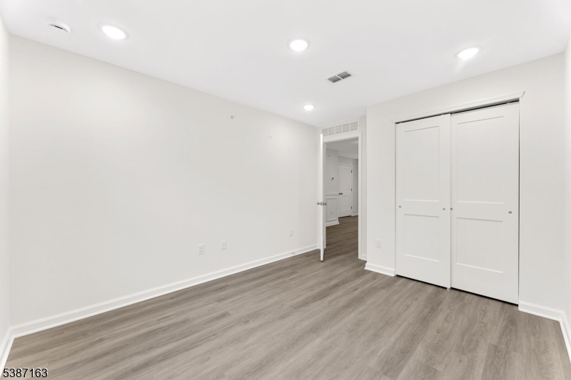 221 Myrtle Road Warren, NJ 07059 - Photo 28 of 37 a view of an empty room with wooden floor