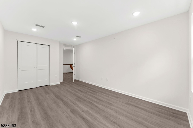 221 Myrtle Road Warren, NJ 07059 - Photo 30 of 37 a view of an empty room with wooden floor