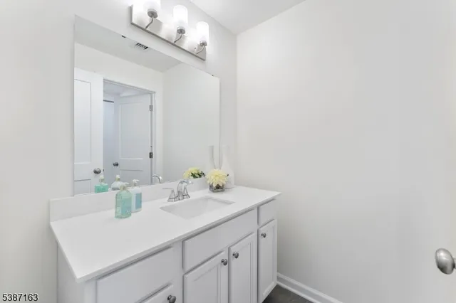 a white bath tub sitting next to a toilet