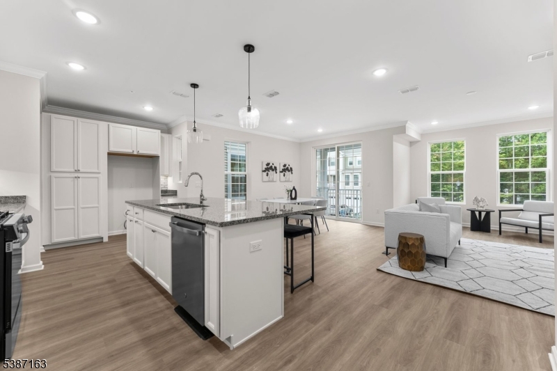 221 Myrtle Road Warren, NJ 07059 - Photo 4 of 37 an open kitchen with white cabinets and stainless steel appliances