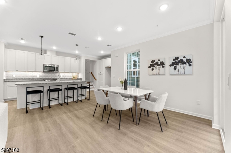 221 Myrtle Road Warren, NJ 07059 - Photo 5 of 37 a view of a dining room with furniture and wooden floor