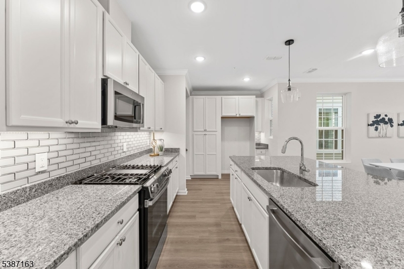 221 Myrtle Road Warren, NJ 07059 - Photo 6 of 37 a kitchen with stainless steel appliances granite countertop a sink stove and refrigerator