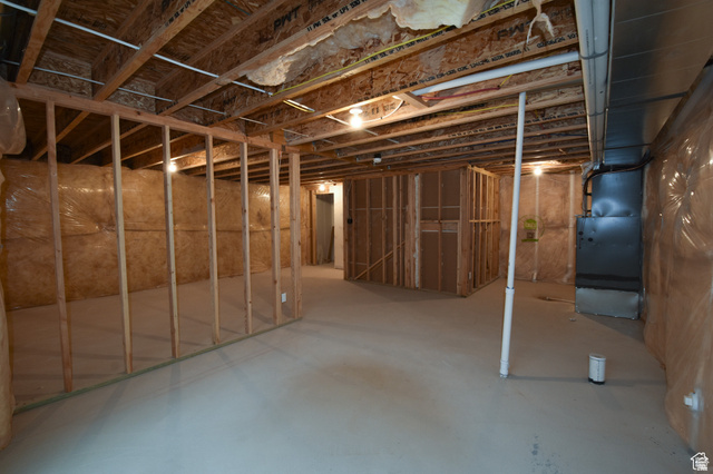 8087 South 615 East, Unit 3 Sandy, UT 84070 - Photo 22 of 23 Unfinished basement with exposed ceiling joists and concrete flooring