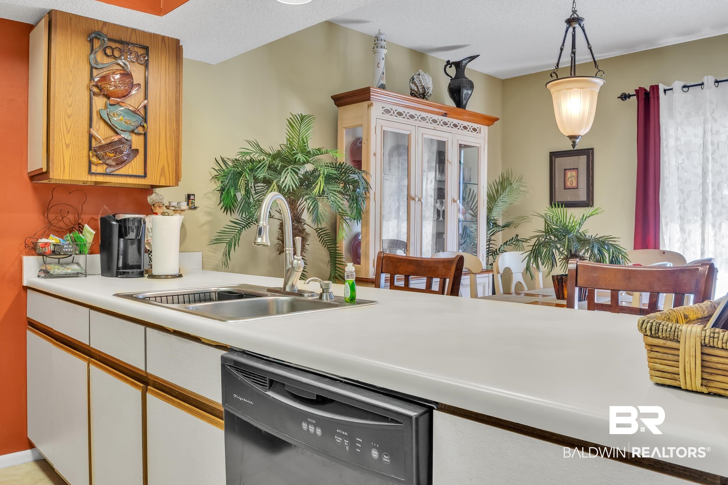 3256 Loop Road, Unit 2 Orange Beach, AL 36561 - Photo 15 of 25 Kitchen featuring white countertops, a stainless steel double basin sink, and an integrated dishwasher