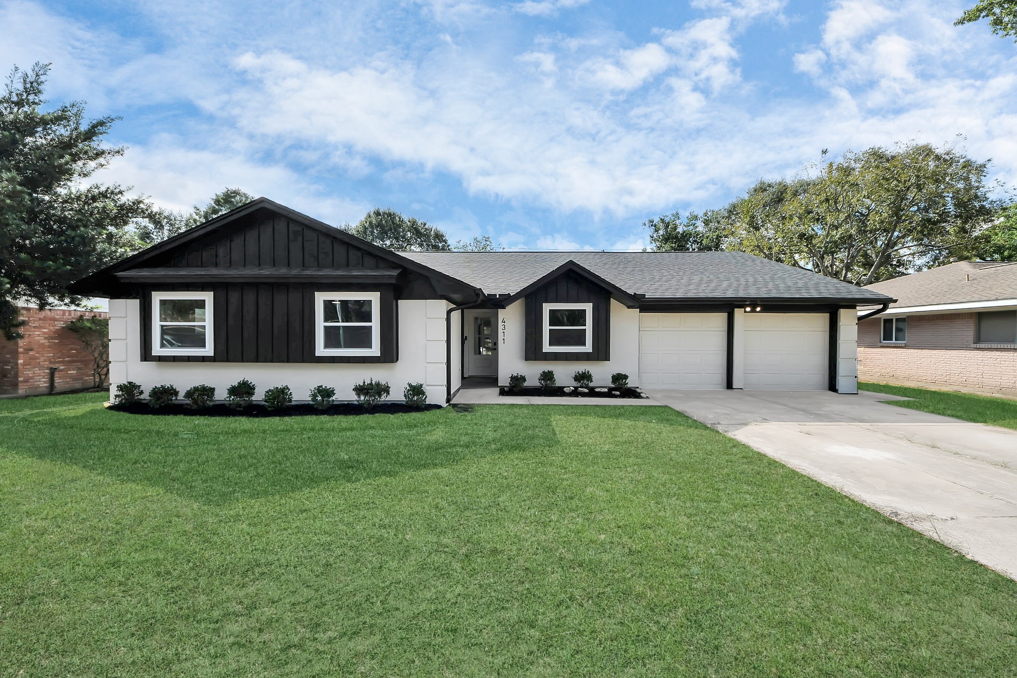 4311 Goldfinch Street Houston, TX 77035 - Photo 1 of 40 a front view of a house with a garden