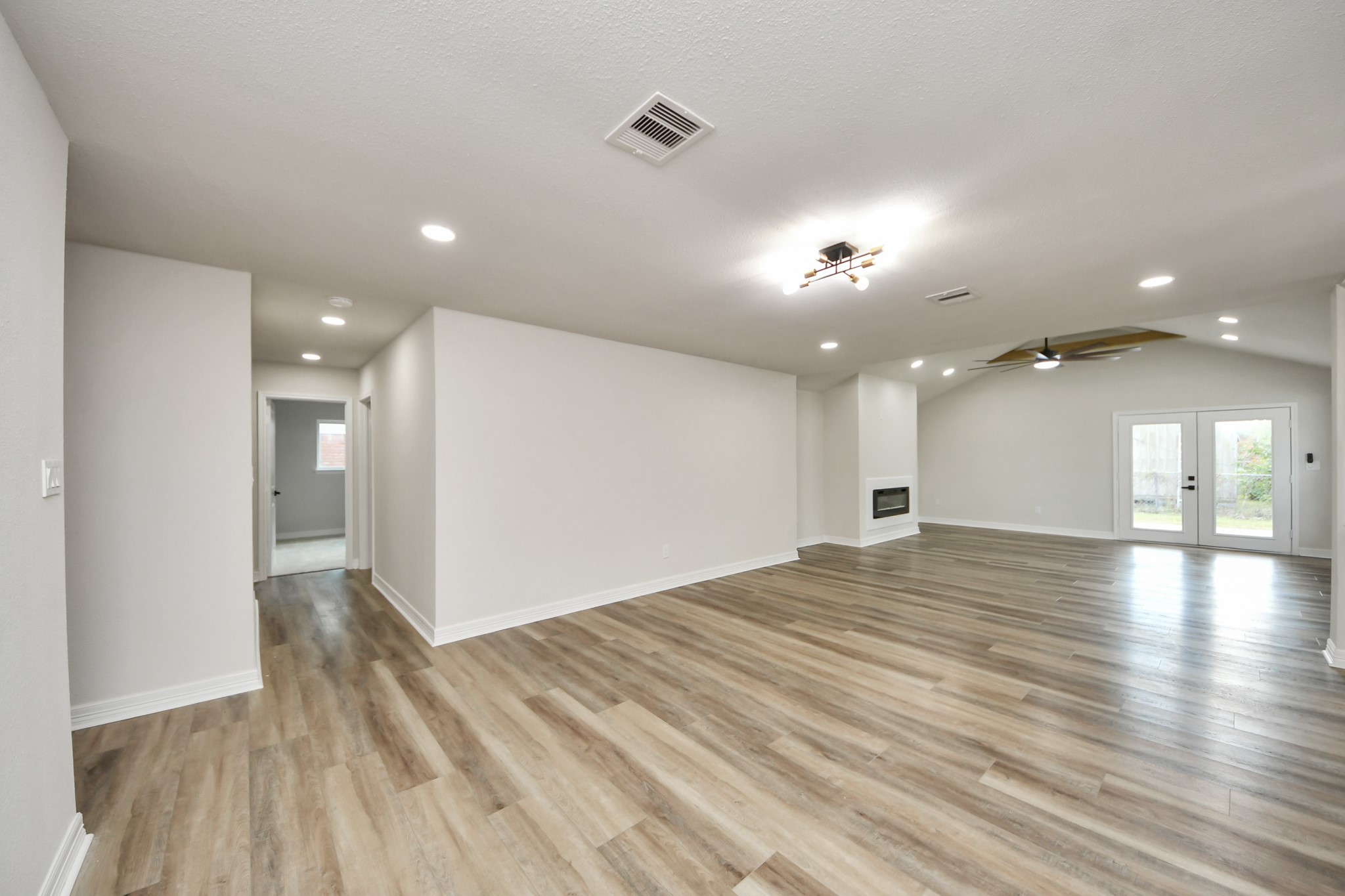4311 Goldfinch Street Houston, TX 77035 - Photo 11 of 40 a view of empty room with wooden floor