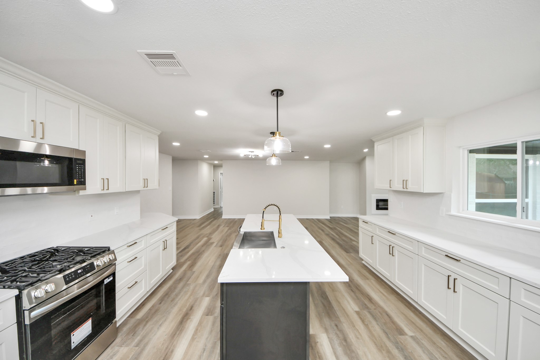 4311 Goldfinch Street Houston, TX 77035 - Photo 16 of 40 a large kitchen with cabinets
