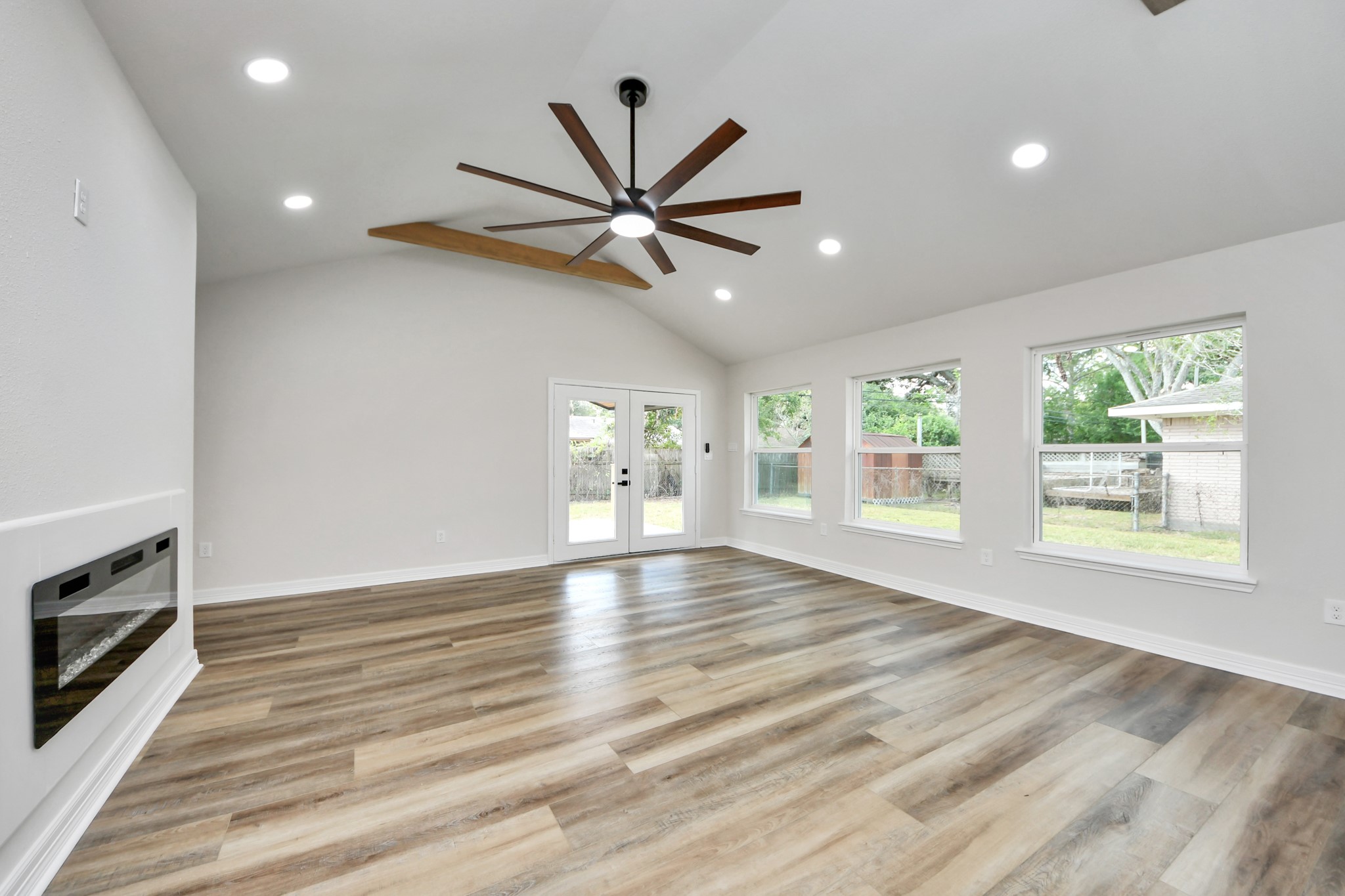 4311 Goldfinch Street Houston, TX 77035 - Photo 21 of 40 a view of an empty room with window and wooden floor