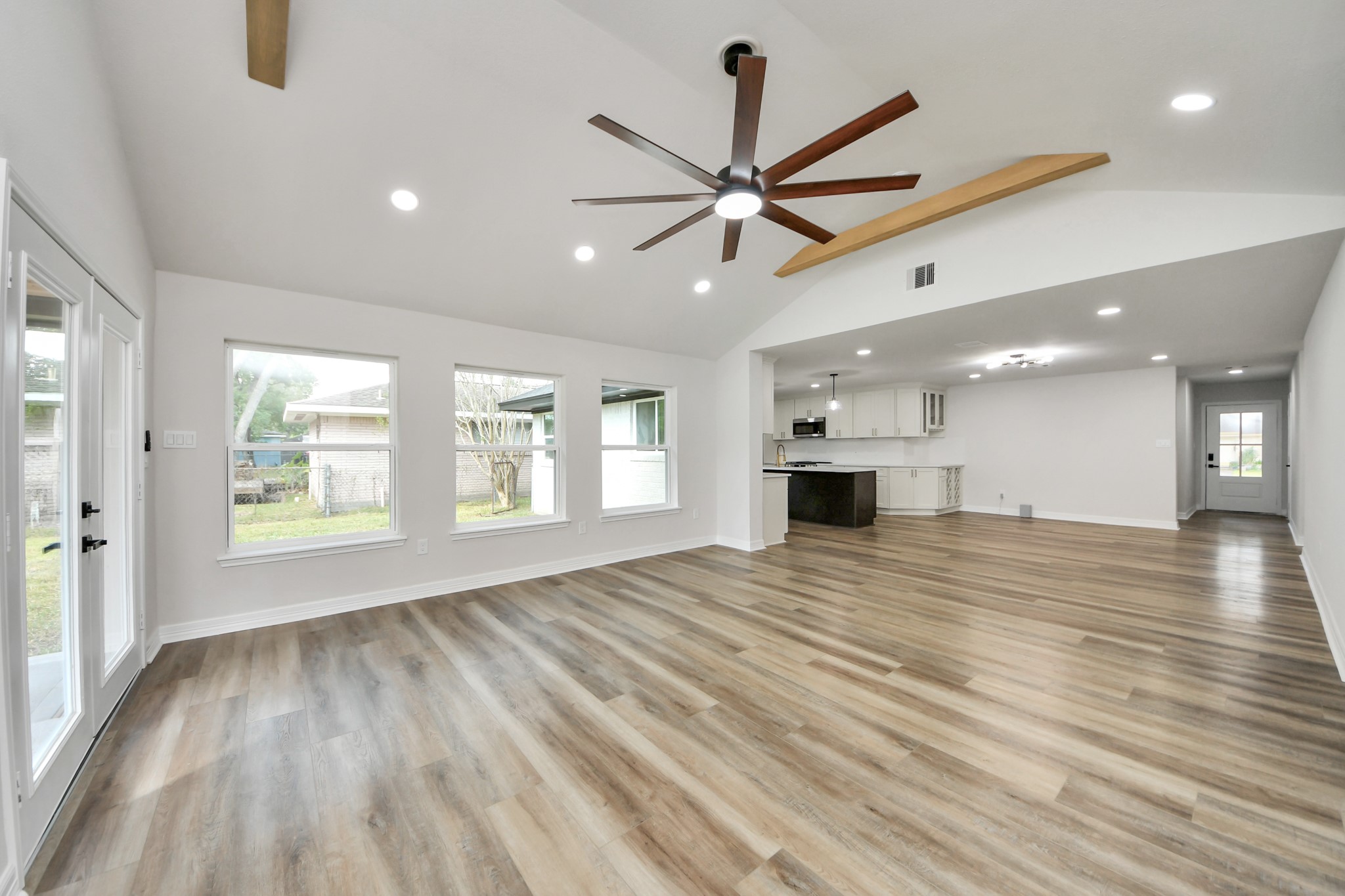 4311 Goldfinch Street Houston, TX 77035 - Photo 23 of 40 a view of an empty room with window and wooden floor