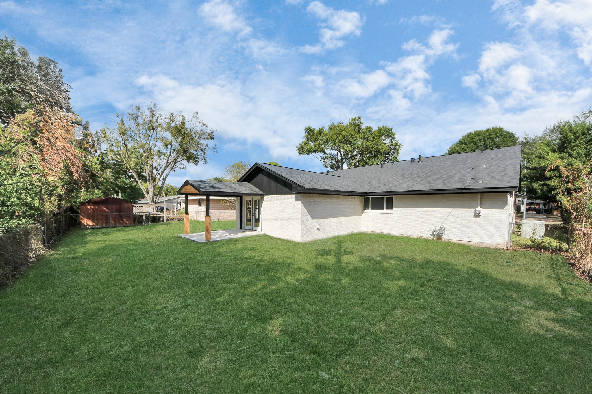 4311 Goldfinch Street Houston, TX 77035 - Photo 40 of 40 a backyard of a house with lots of green space and garden