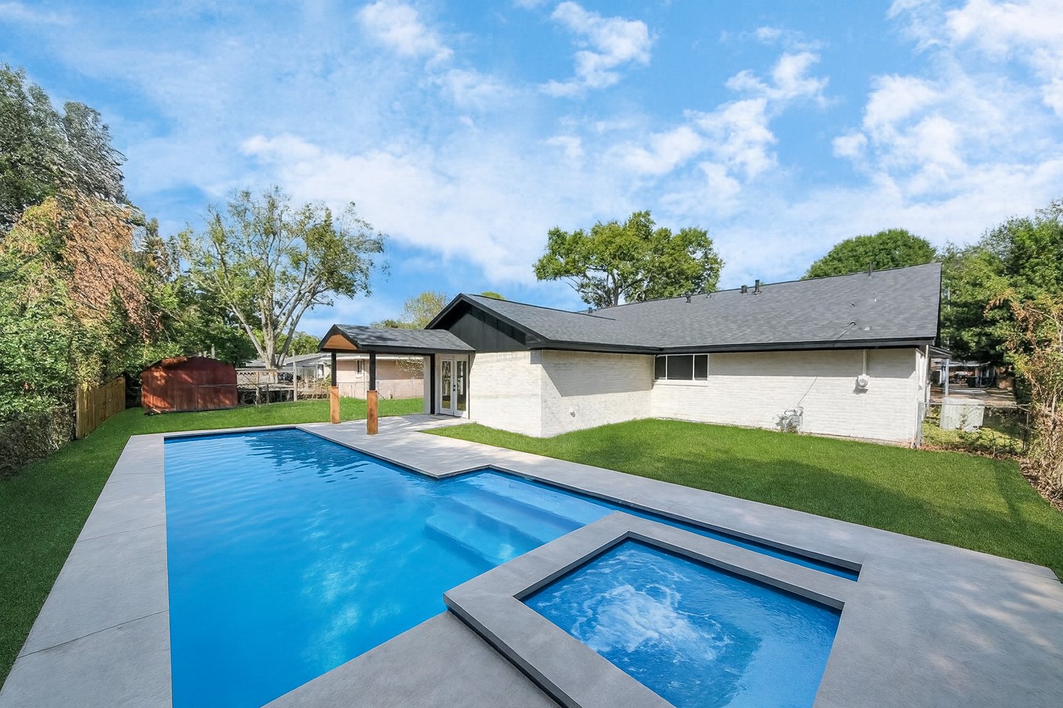 4311 Goldfinch Street Houston, TX 77035 - Photo 4 of 40 a view of a house with pool and a yard