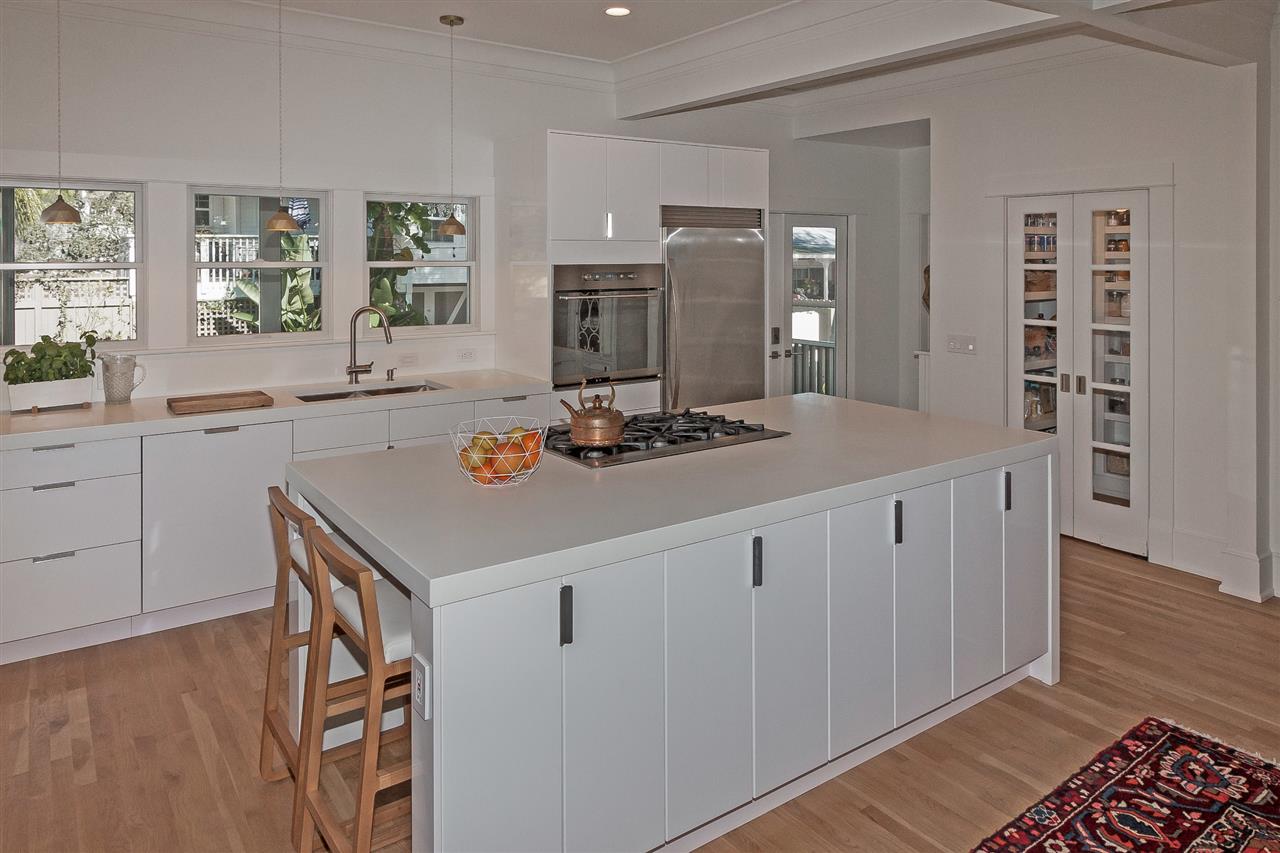 28 Rohde Avenue St. Augustine, FL 32084 - Photo 11 of 48 a kitchen with a sink cabinets and wooden floor