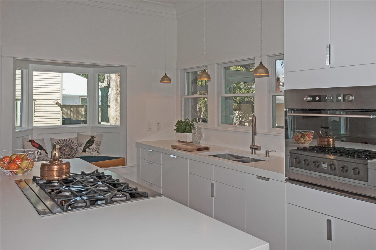 28 Rohde Avenue St. Augustine, FL 32084 - Photo 12 of 48 a kitchen with stainless steel appliances a stove a sink and a refrigerator
