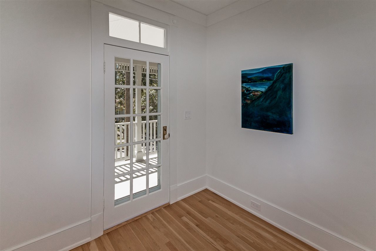 28 Rohde Avenue St. Augustine, FL 32084 - Photo 30 of 48 a view of an empty room with wooden floor and a window