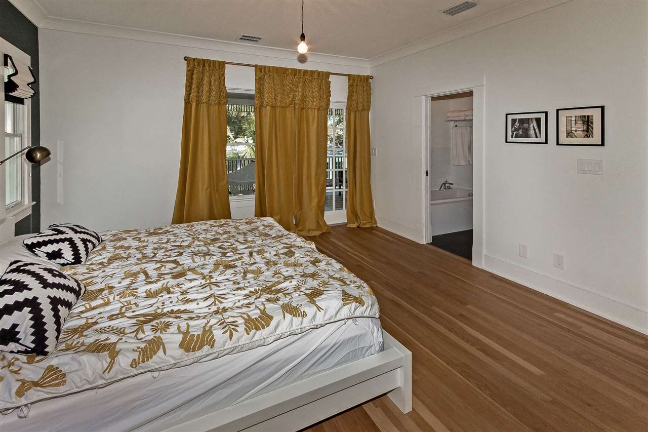 28 Rohde Avenue St. Augustine, FL 32084 - Photo 34 of 48 a bedroom with a bed and a large mirror