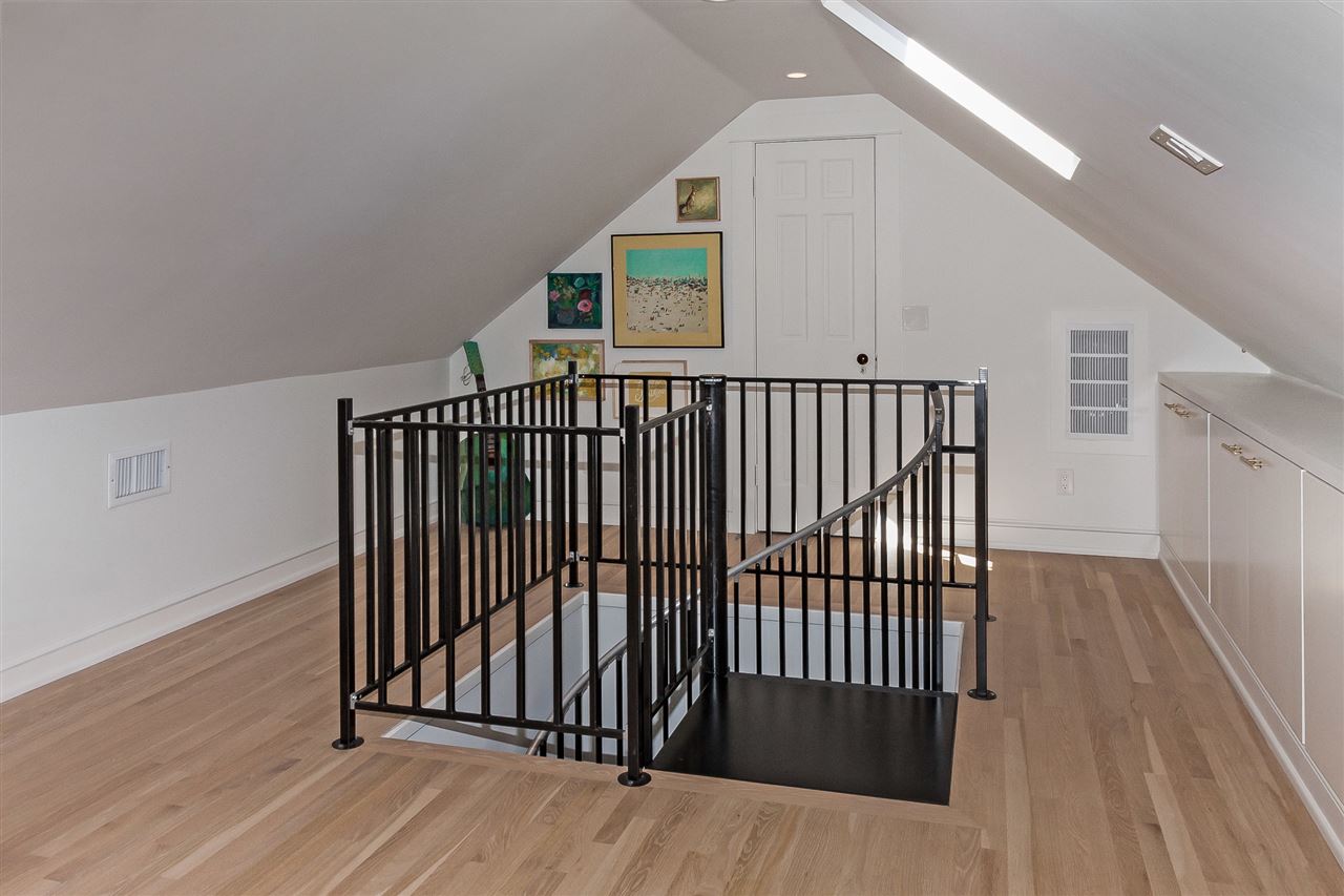 28 Rohde Avenue St. Augustine, FL 32084 - Photo 39 of 48 a view of a hallway with wooden floor and stairs