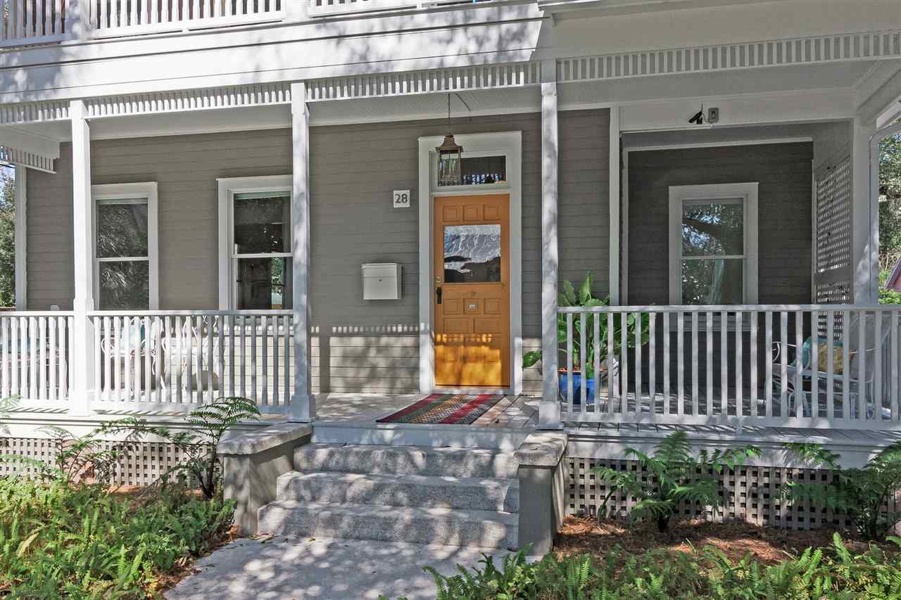 28 Rohde Avenue St. Augustine, FL 32084 - Photo 4 of 48 front view of a house with a bench