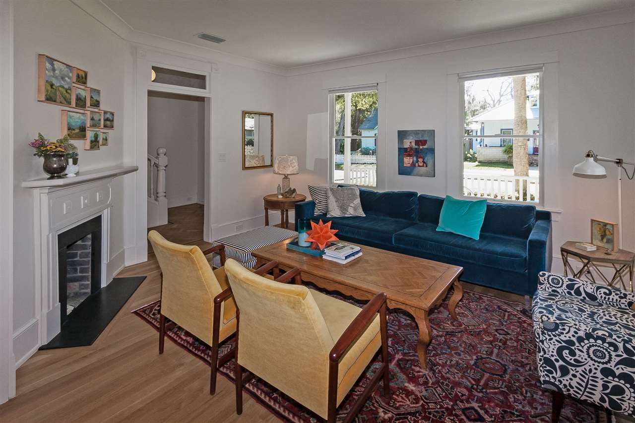 28 Rohde Avenue St. Augustine, FL 32084 - Photo 7 of 48 a living room with furniture a flat screen tv and a fireplace