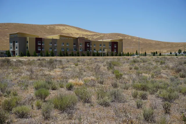 a view of a balcony with a floor to ceiling window