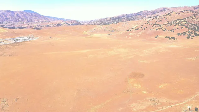 a view of an ocean and a mountain