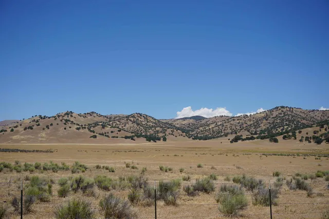 a view of a large building with a mountain in the background